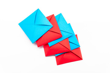 Square envelope made of red and blue paper. Origami envelope on white background