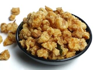 A small portion of fried corn nuts isolated on a white background.