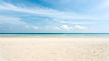 The vast ocean meets the sandy beach under a vibrant blue sky, creating a picturesque tropical seascape perfect for summer vacations