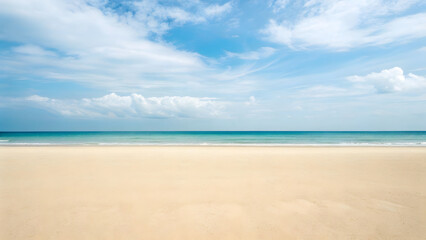 Obraz premium The vast ocean meets the sandy beach under a vibrant blue sky, creating a picturesque tropical seascape perfect for summer vacations