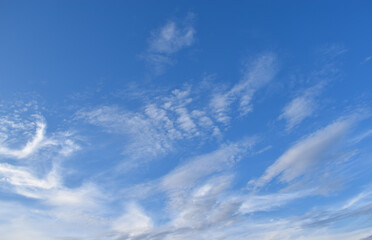 Photography Clear blue sky with few clouds. The sky is very clear and clouds are scattered everywhere. Suitable for background, cover, poster, banner, header, website.