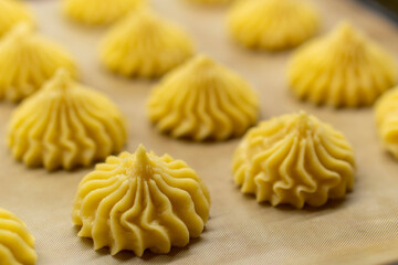 The Making of mini vanilla eclairs.Dessert, profiteroles. Food concept