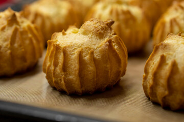 The Making of mini vanilla eclairs.Dessert, profiteroles. Food concept