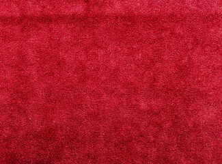 A red carpet with a shiny surface