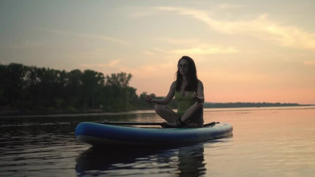 peaceful and serene scene shows a woman meditating