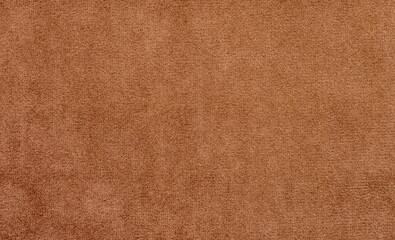 A brown carpet with a pattern of small squares
