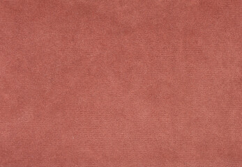 A close up of a red fabric with a grainy texture