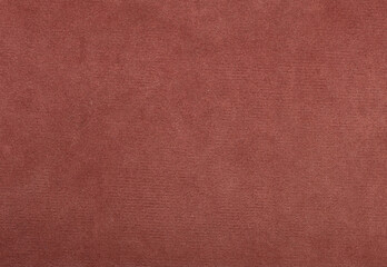 A close up of a red fabric with a pattern