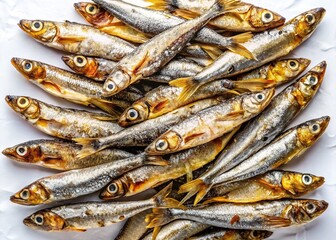 Obraz premium Crispy salted anchovies, a delicious dried fish delight. Top view.