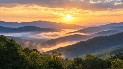 Obraz premium Serene sunrise with soft golden light spreading across misty mountain ranges