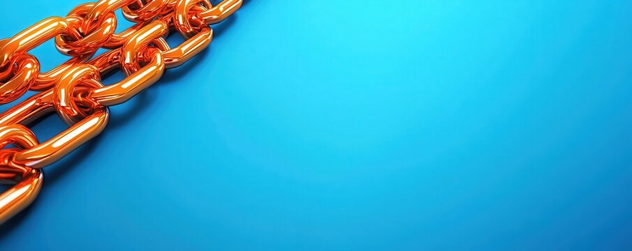 A close-up of an orange metal chain against a vibrant blue background, highlighting the texture and color contrast.