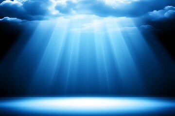 Fototapeta premium Heavenly blue light rays breaking through dark clouds.