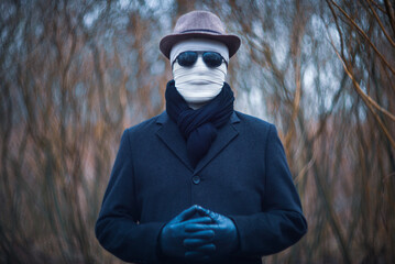 An elegant man with a bandaged face.