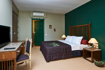 Green hotel room concept interior style, old furniture retro decoration.