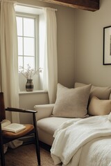 Fototapeta premium A guest room with soft linens, layered textures, and a small reading corner.