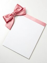 Blank white sheet with pink bow on isolated white background for your presentation or bussines design.