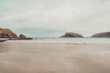 Moody beach background, cliffs in ocean