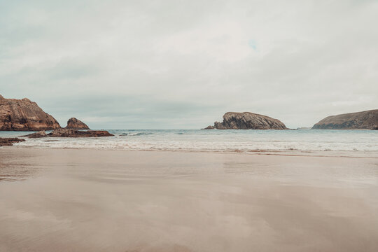 Moody beach background, cliffs in ocean