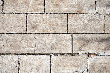 High-resolution image of a grey stone pavement texture. Shows detail of the stones and mortar, ideal for background or texture use