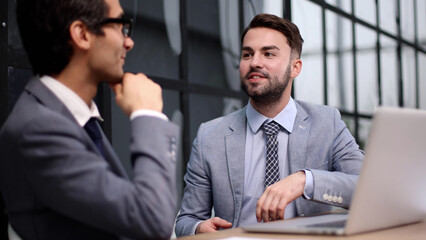 Business people discussing over new business project in office.