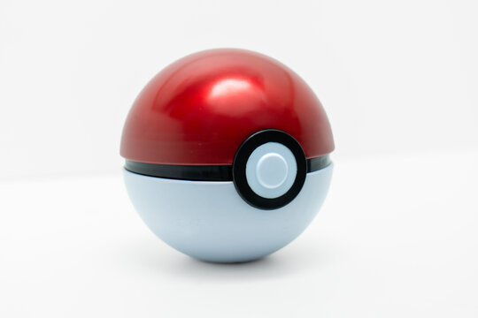 A red and white child's Pok&eacute; Ball from the mega popular Japanese Pok&eacute;mon franchise.
