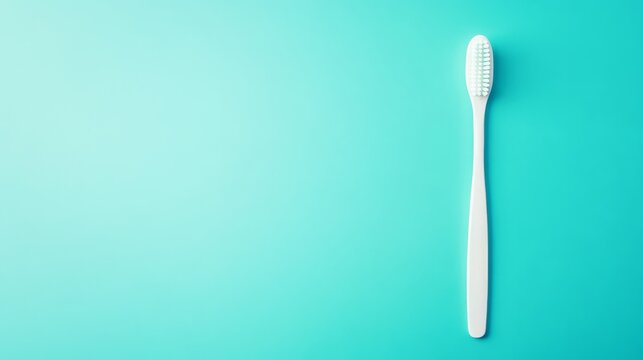 White toothbrush lies on blue background, highlighting eco-friendly oral care and basic bathroom needs with space for text