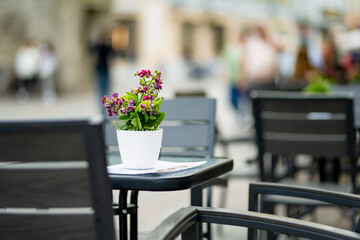 Outdoor restaurants and cafes on narrow medieval street of Tallinn Old Town or Tallinna Vanalinn, included in the UNESCO World Heritage List