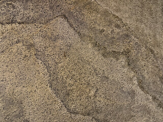 Close up texture of natural brown and grey stone granite slab pattern in marble looking veining and grains, Seamless texture