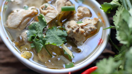 Spicy Chicken Soup,Chicken tom yum in a white bowl with vegetables