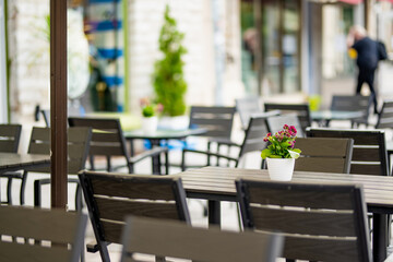 Outdoor restaurants and cafes on narrow medieval street of Tallinn Old Town or Tallinna Vanalinn, included in the UNESCO World Heritage List