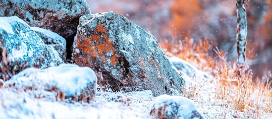 Snowy rocks, autumnal backdrop, mountain frost, winter scene