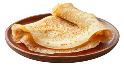 plate of two folded crepes. showcasing their golden-brown color and delicate texture the crepes are served on a round wooden plate. highlighting their culinary appeal. often enjoyed as a breakfast or