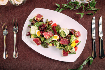 Portion of gourmet nicoise salad with tuna and vegetables