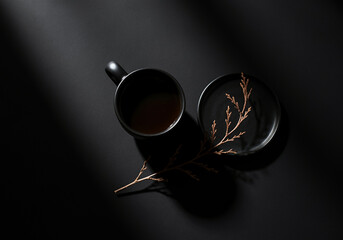 candle on black, coffee cup on a table with coffee beans, coffee and black background  