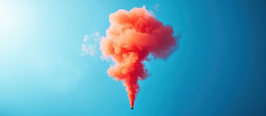 Orange smoke plume outdoors, sunny sky