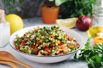 A bowl with traditional vegetable Israeli Salad