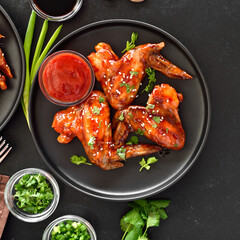Baked chicken wings on plate