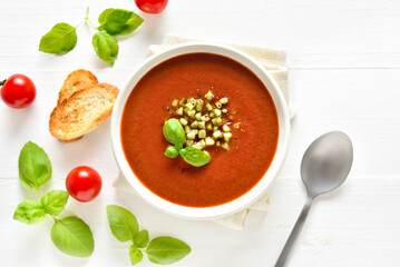 Gazpacho soup in white bowl