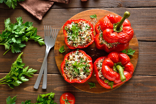 Baked stuffed red bell peppers with minced meat, rice, parmesan cheese