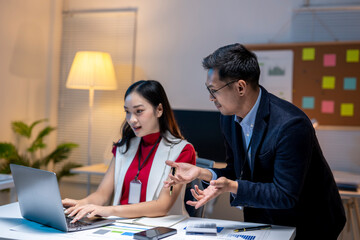 Asian business people having disagreement working late at office