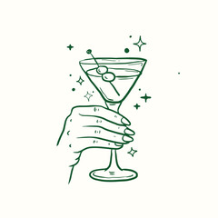 Hand holding martini cocktail glass 