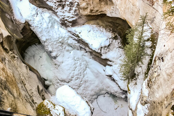 A snow covered mountain with a large hole in the middle