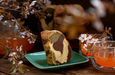 Homemade tricolor bundt Marble cake sprinkled with matcha powder