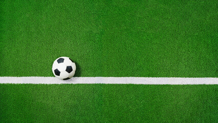 green grass texture with soccer ball on the line - well-groomed turf in the stadium