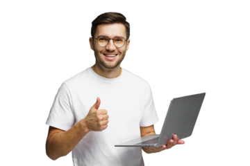 Man smiling and giving thumbs up while holding a laptop in a bright indoor setting