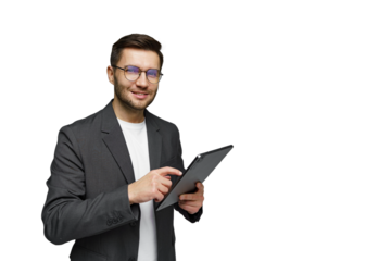 Professional man using a tablet and smiling in a modern office setting