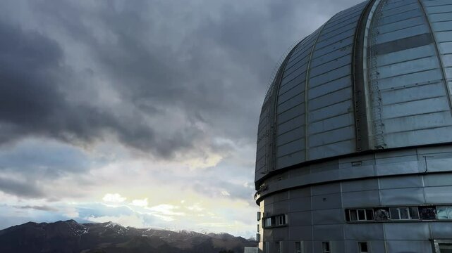 Big optical telescope, observatory is designed for observing rare cosmic phenomena and celestial bodies, located in mountains for optimal stargazing and research. Scientific surveillance equipment