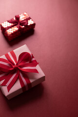 Valentine's day celebration gift boxes on the red background. Copy space