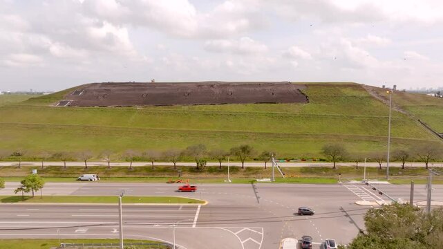 Wheelabrator South Broward. Aerial video waste to energy landfill mountain
