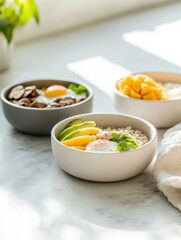 Delightful breakfast bowls with quinoa, oatmeal, and rice on a sunny countertop